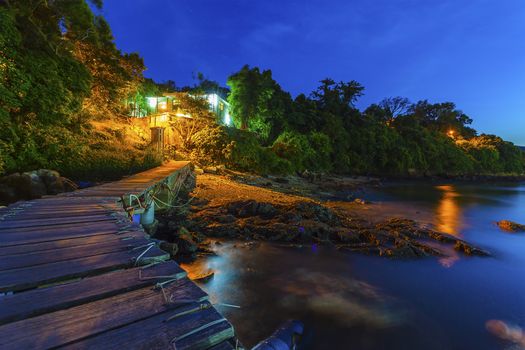 Wooden bridge along the coast at sunset