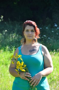 Woman in a meadow with flowers