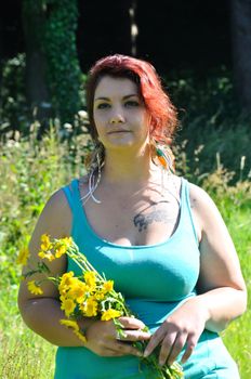 Woman in a meadow with flowers