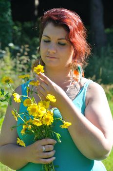 Woman in a meadow with flowers