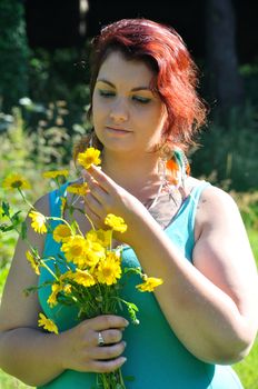 Woman in a meadow with flowers