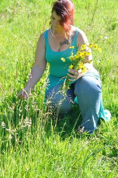 Woman in a meadow with flowers