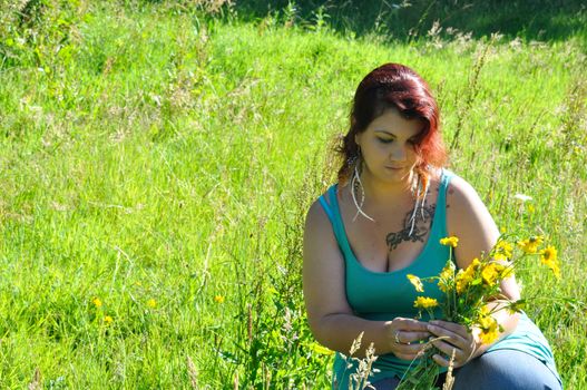 Woman in a meadow with flowers