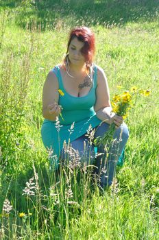 Woman in a meadow with flowers