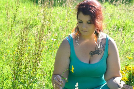 Woman in a meadow with flowers