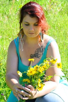 Woman in a meadow with flowers