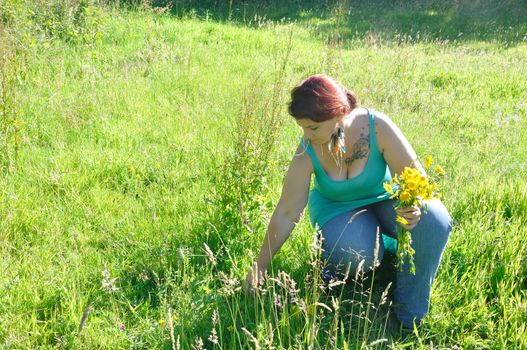 Woman in a meadow with flowers