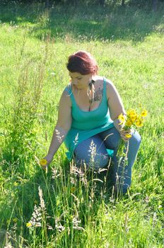 Woman in a meadow with flowers