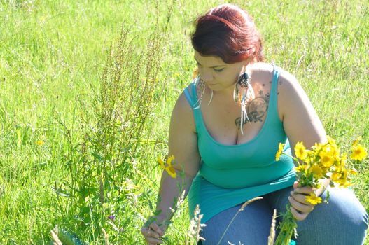 Woman in a meadow with flowers