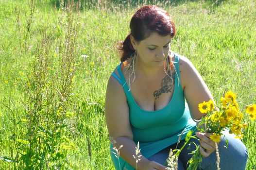 Woman in a meadow with flowers