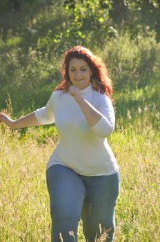 Woman running in a meadow 