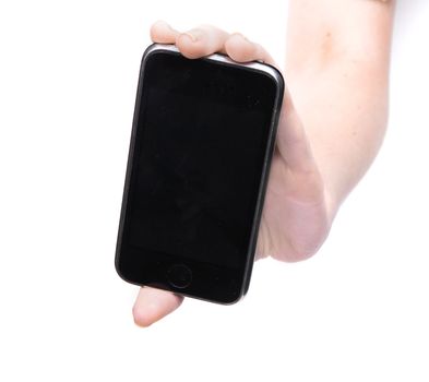 Female hand holding a phone on an isolated white background