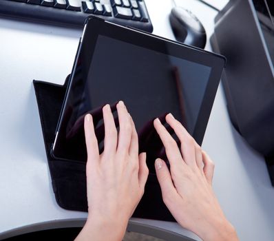 business woman in the workplace is working on a tablet