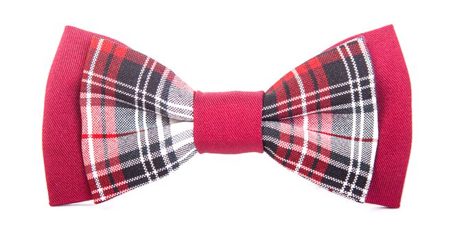 red bow tie with a black pattern on an isolated white background