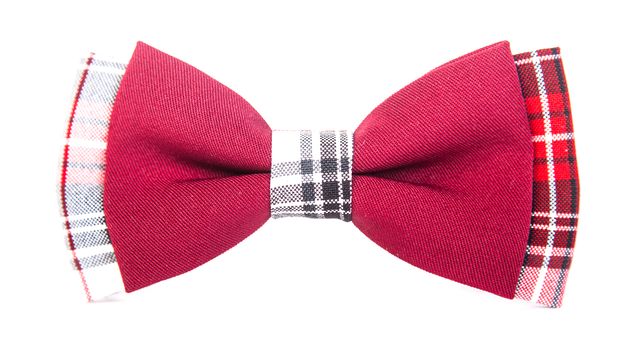 red bow tie with a black pattern on an isolated white background