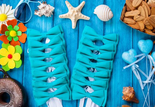 turquoise bow tie on the sea background