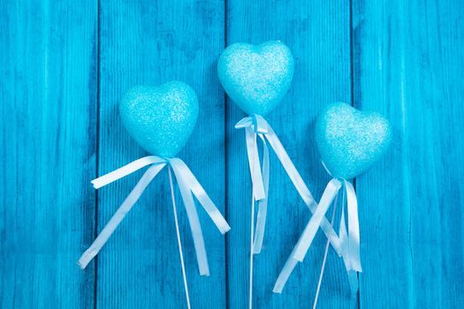blue hearts on a blue wooden background