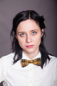 Girl brunette office worker with bow tie