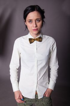 Girl brunette office worker with bow tie