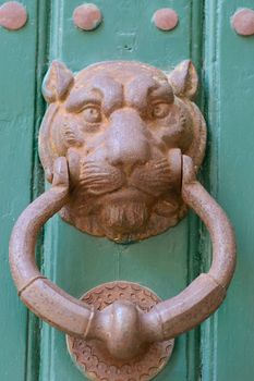 antique door knocker shaped metal lion head