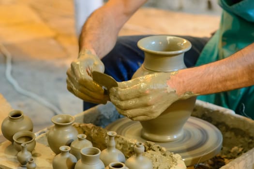 Master potter at work as he creates a vase