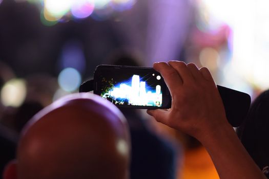 man takes the phone the lights in Apulia