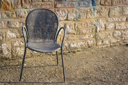 Old rusty metal chair found in the port