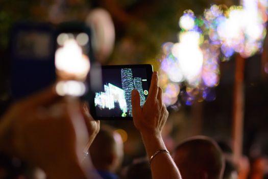 man takes the phone the lights in Apulia