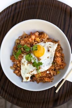 Fried egg, rice and shrimp in a bowl