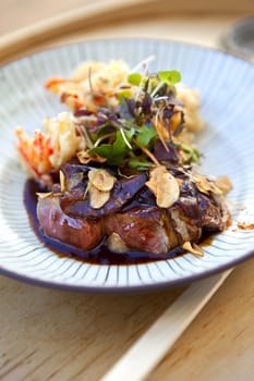 Beef, soy sauce, fried vegetable and green salad