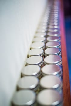 Milk tablets jar on the table, depth