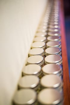 Milk tablets jar on the table, depth