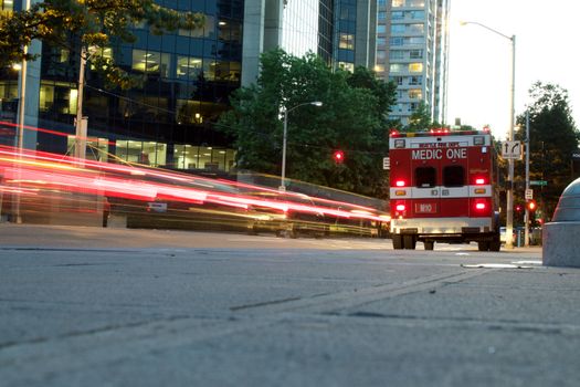 Ambulance in Seattle with light trails on road