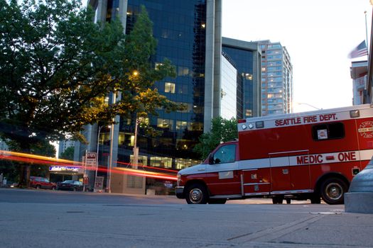 Seattle, WA - July 24, 2015 - Ambulance in Seattle with light trails on road