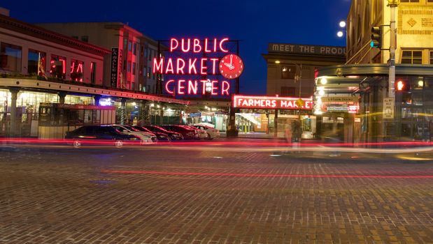 Seattle, WA - July 24, 2015 - Pike Place Public Market Center Sign at Night with Light Trails