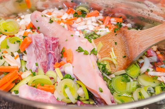 Delicious stew in an open pot, top view
