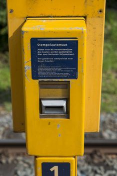 old train ticket stamping machine in holland for the old paper cards
