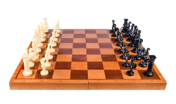Chess pieces in the form of the Romans, vytsroennye the beginning of the game on a wooden lacquered chess board on a white background