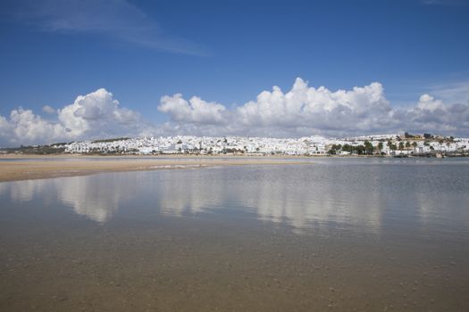 landscape from water of white houses Conil de la Frontera village Andalusia Spain Europe