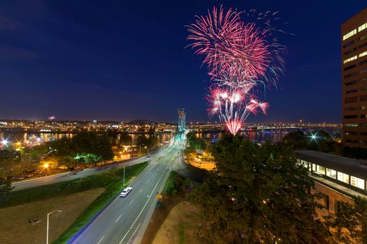 4th of July Fireworks at Portland Oregon downtown waterfront by Hawthorne Bridge during evening blue hour