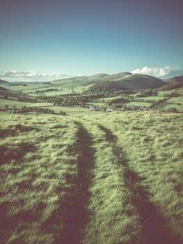 Winding Path Or Track High In The Hills Of A Rolling Rural Landscape