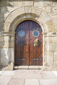 wood door of public hermitage Guia Virgin in Ribadesella town Asturias Spain Europe