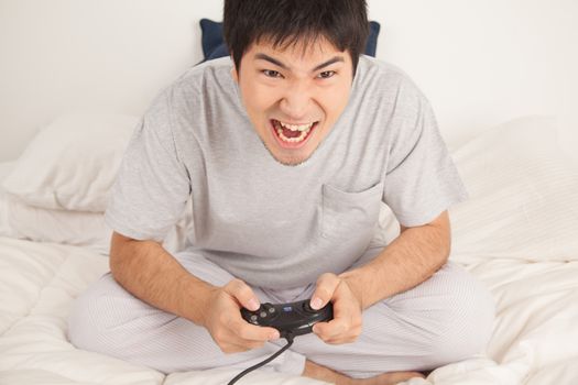 Man playing video games and shouting