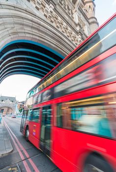 Red Double Decker Bus crossing Tower Bridge.