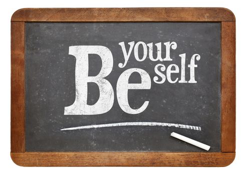 Be yourself sign - motto or resolution on a vintage slate blackboard