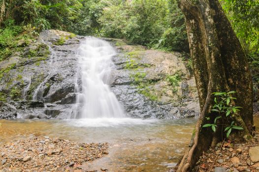 Beautiful little waterfall in rain forest, Thailand.