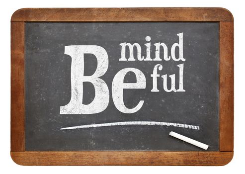 Be mindful sign - motto or resolution on a vintage slate blackboard