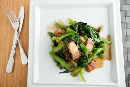 Thai style crispy pork dish with Chinese broccoli.