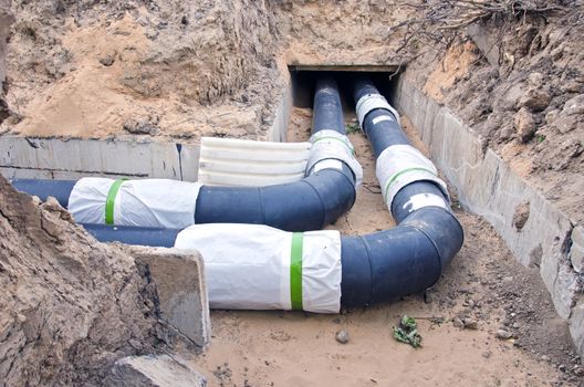  plastic modern technology black heating pipes in trench near city house