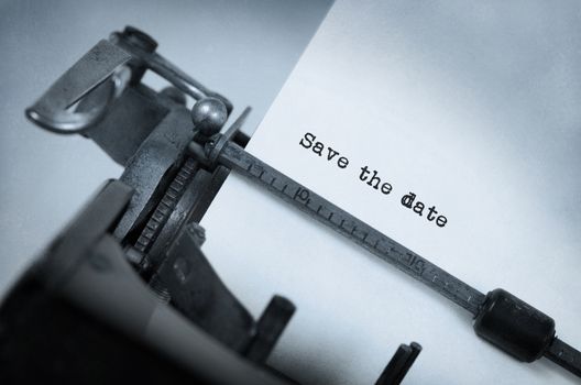 Vintage typewriter, old rusty, warm yellow filter - Save the date